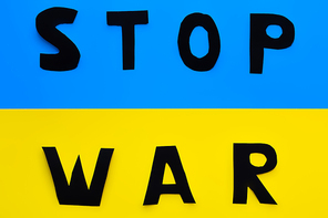 Top view of stop war lettering on ukrainian flag