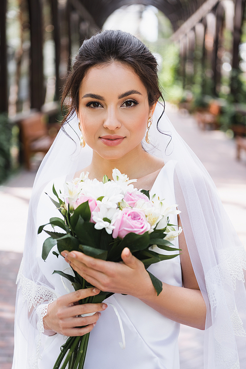 Bride with bouquet  outdoors