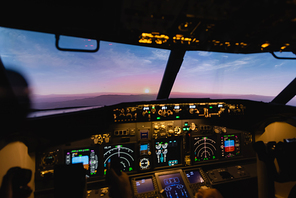 blue and pink sky during sunset through cockpit windows
