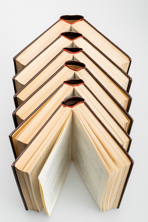 high angle view of open books on grey background