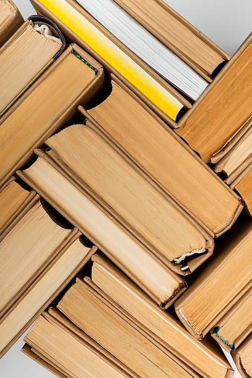 top view of paper books collection isolated on grey