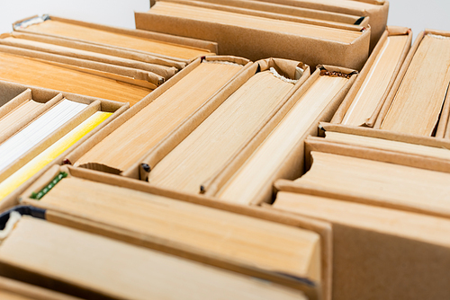 close up view of plenty of books isolated on grey