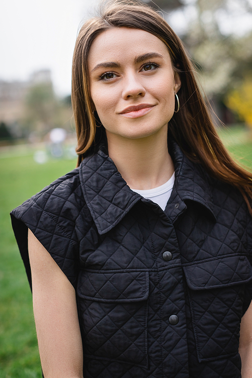 portrait of young pretty woman in sleeveless jacket