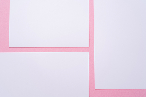 top view of blank empty papers on pink
