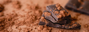 Close up view of natural chocolate and cocoa on brown background, banner