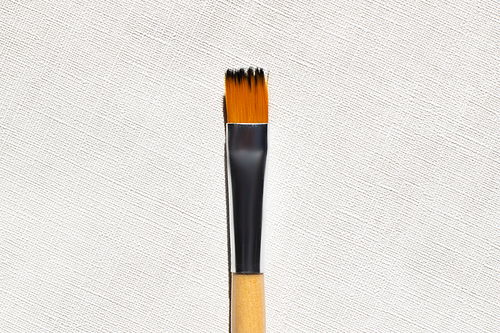 top view of paintbrush on textured background