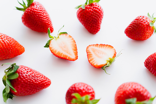 Close up view of fresh strawberries on white background