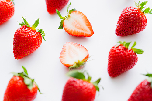 Close up view of fresh strawberries on white background