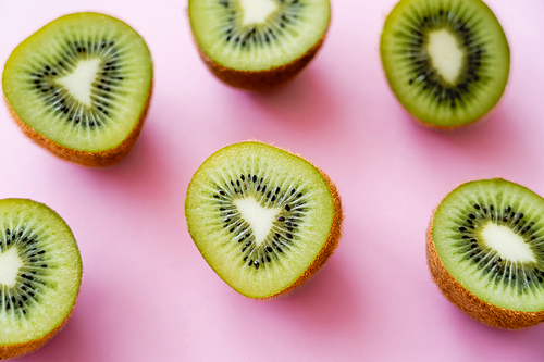 organic and sweet kiwi halves on pink