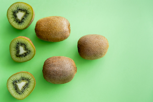 top view of fresh kiwi fruit on green