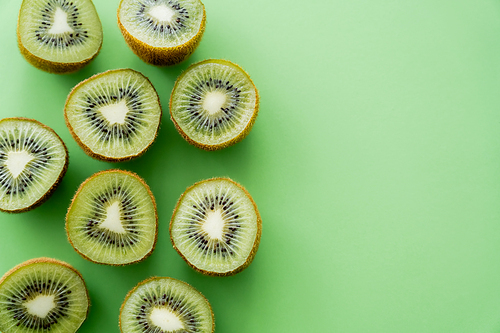top view of juicy fresh kiwi fruit on green