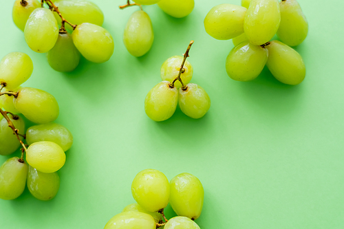 top view of delicious grapes on green