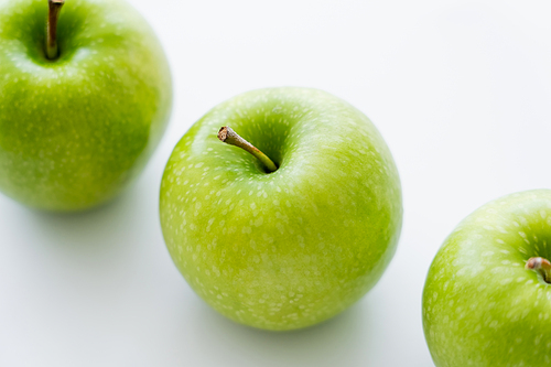 flat lay of tasty whole apples on white