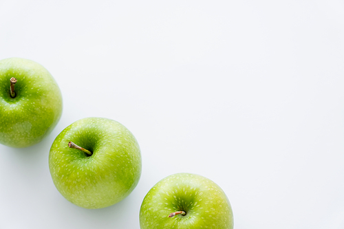 high angle view of tasty whole apples on white