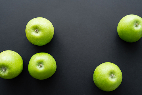 top view of healthy and green apples on black