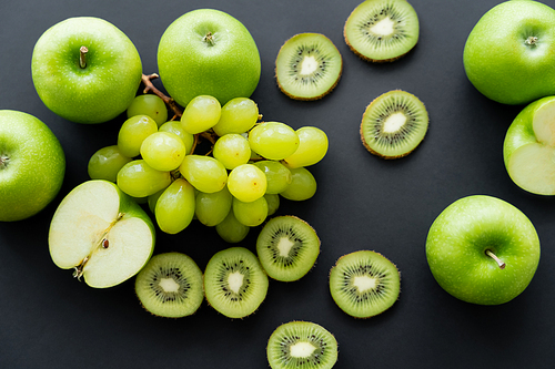 top view of green fresh fruits on black