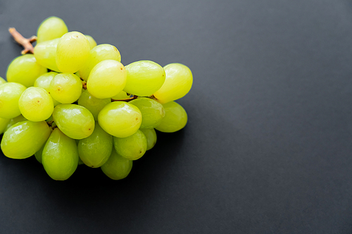 top view of delicious grapes on black