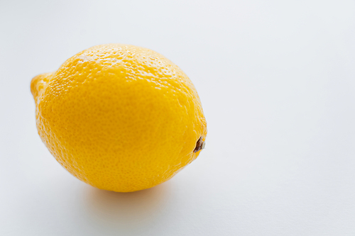 Close up view of juicy lemon on white background