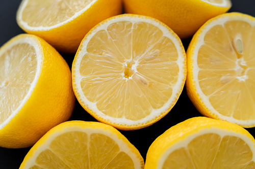 Close up view of juicy lemons isolated on black