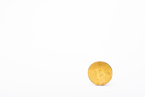 KYIV, UKRAINE - APRIL 26, 2022: Golden bitcoin on white background