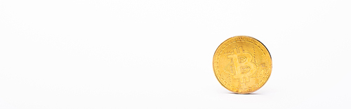 KYIV, UKRAINE - APRIL 26, 2022: Golden crypto coin on white background, banner
