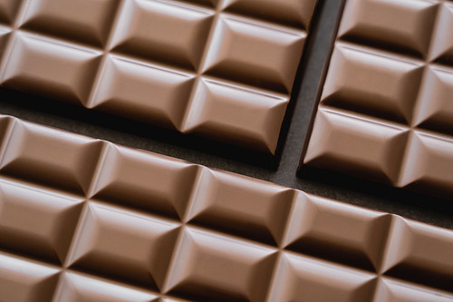 Top view of chocolate bars on black background