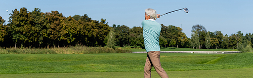 asian senior man playing golf, banner