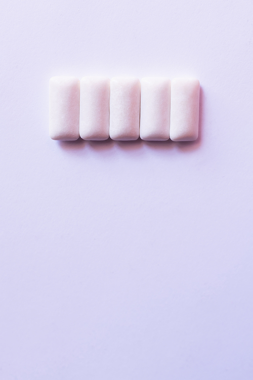 Top view of chewing gums on white background with copy space