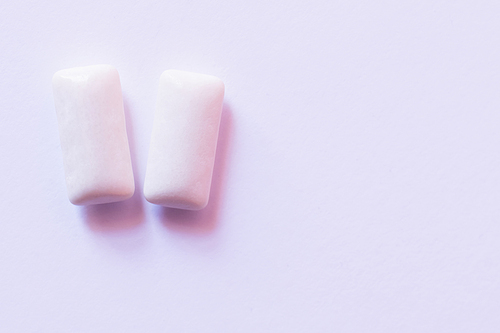 Close up view of chewing gums on white background