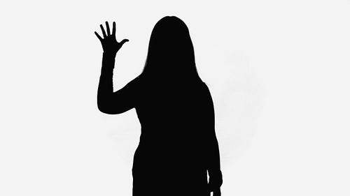 black silhouette of woman waving hand isolated on white