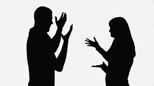 shadows of husband and wife quarreling and gesturing isolated on white