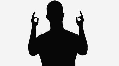 black silhouette of man showing okay signs isolated on white