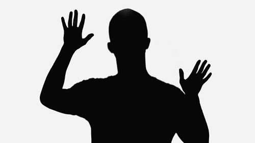 black silhouette of man waving hands isolated on white