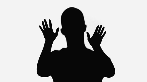 black shadow of man waving hands isolated on white