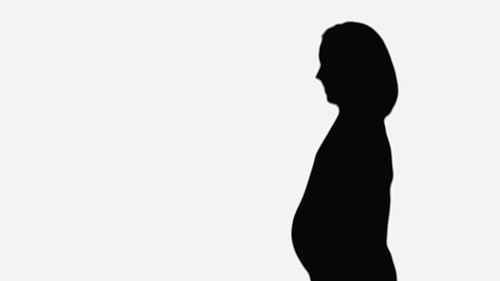 black silhouette of pregnant woman isolated on white