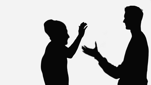 black silhouettes of friends greeting each other while meeting isolated on white