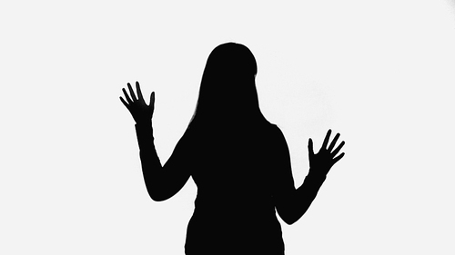 black shadow of woman waving hands isolated on white