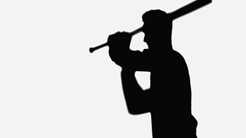 silhouette of man with baseball bat isolated on white