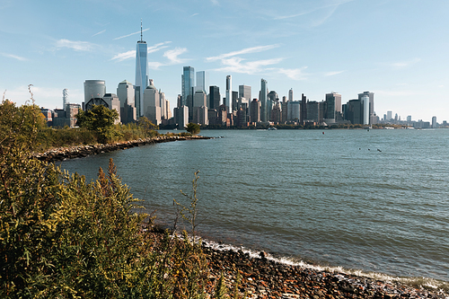 riverbank of Hudson river with skyscrapers of Manhattan in New York City