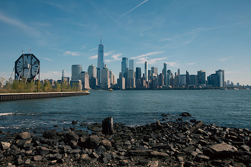 scenic cityscape with Hudson river and modern skyscrapers of Manhattan in New York City