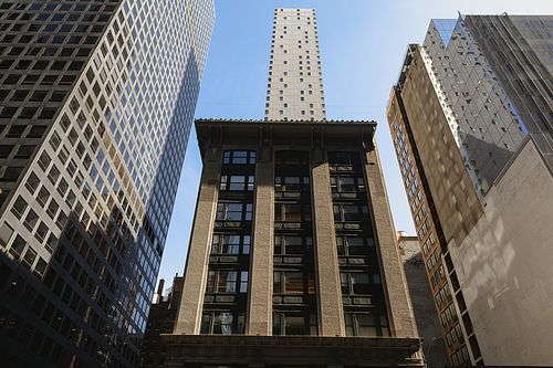 low angle view of Rockefeller Center and stone building in downtown of New York City