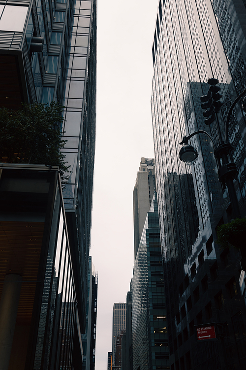 low angle view of modern high-rise buildings on urban street of New York City
