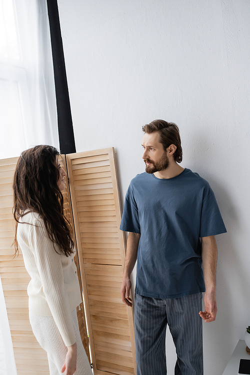 Angry couple in pajama quarrelling during relationship difficulties at home in morning