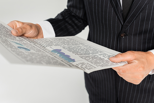 cropped view of businessman holding newspaper isolated on grey