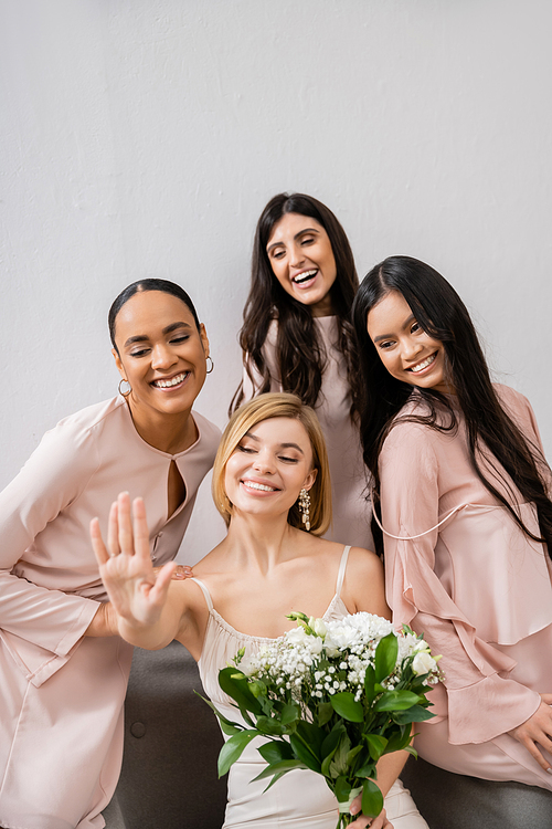 wedding photography, cultural diversity, four women, bride with her multicultural bridesmaids looking at engagement ring, brunette and blonde, positivity and joy, celebration