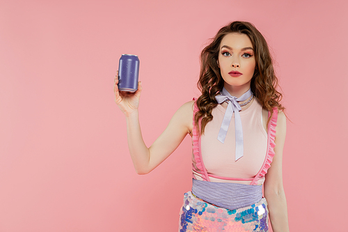 doll concept, attractive young woman with wavy hair holding soda can with carbonated drink, advertisement, standing on pink background, fashion model in stylish outfit, femininity, doll pose