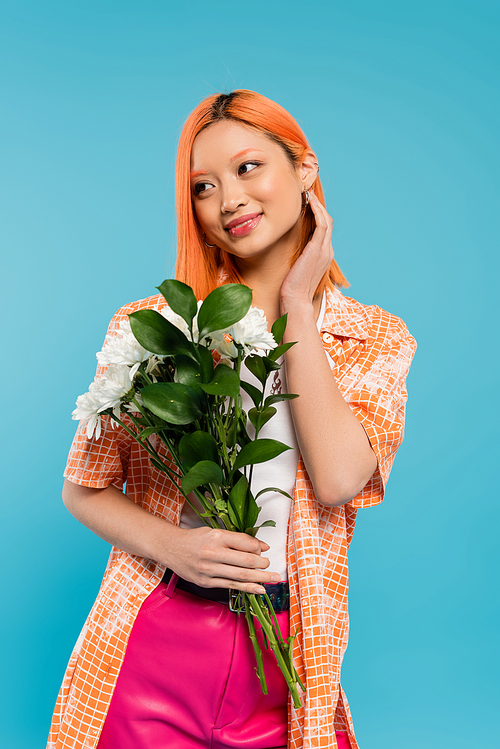 sensuality, joyful asian woman with red hair holding white flowers on blue background, casual attire, generation z, floral bouquet, spring vibes, happy face, generation z, youth culture