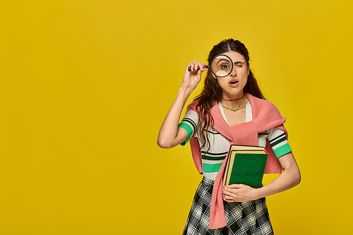 curious student holding books and magnifier, zoom, discovery, young woman in college outfit, yellow
