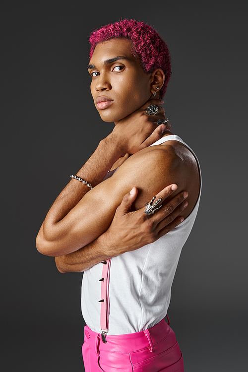 young african american man with crossed arms in accessories looking at camera, fashion and style