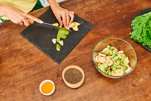 top view of cropped woman preparing fruit salad near sesame seeds and honey, vegetarian recipe